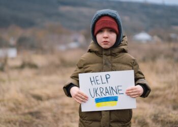 Help Ukraine. War of Russia against Ukraine. Ukrainian Crying boy asks to stop the war in Ukraine.