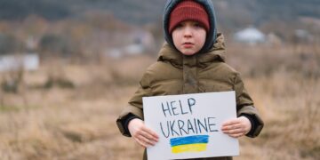 Help Ukraine. War of Russia against Ukraine. Ukrainian Crying boy asks to stop the war in Ukraine.