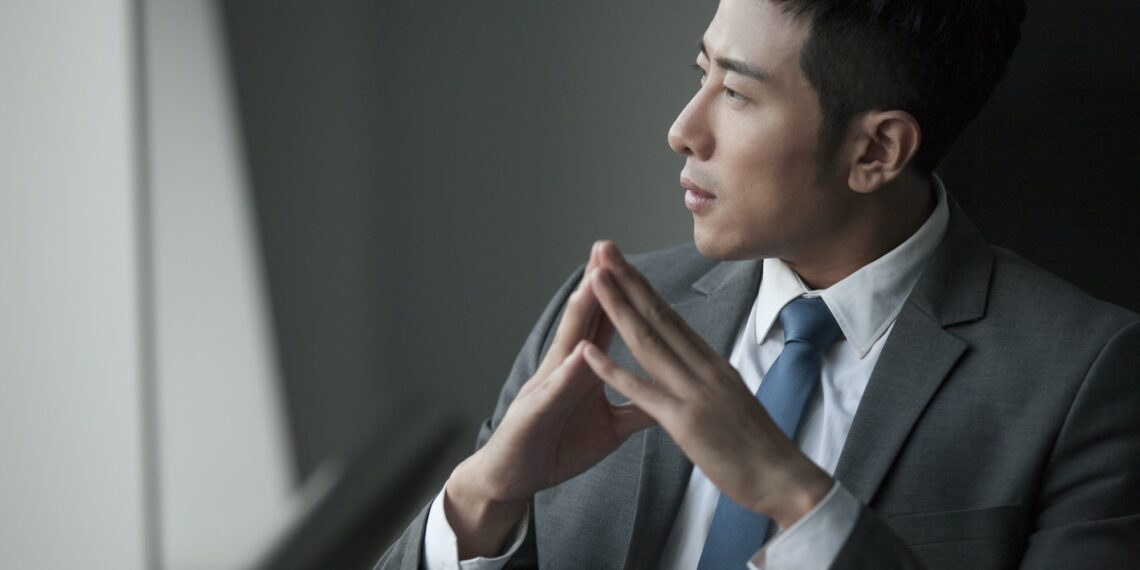 Young businessman thinking