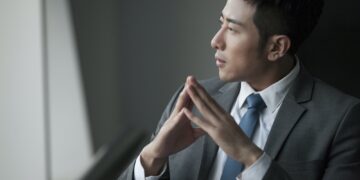 Young businessman thinking